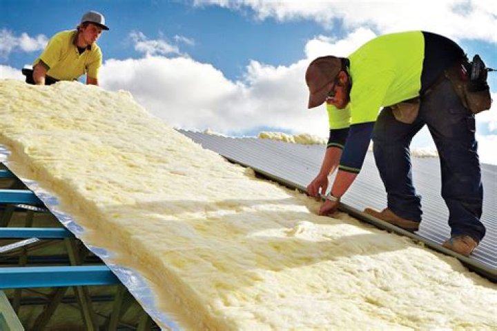 How do you install insulation on a metal roof