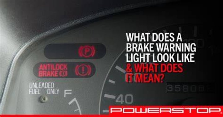 What should a driver do if the brake indicator light lights up?
